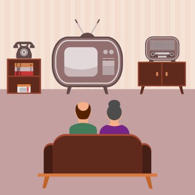 Çift eski bir tv izliyor 