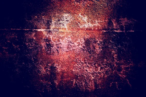 Orange bright spot on the grunge wall in the middle of the night a terrible darkness. Old concrete texture. Rustic background.
