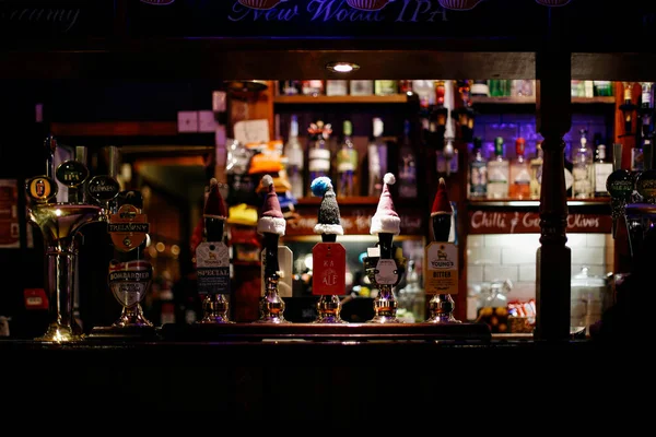 Funny winter hats on the taps — Stock Photo, Image