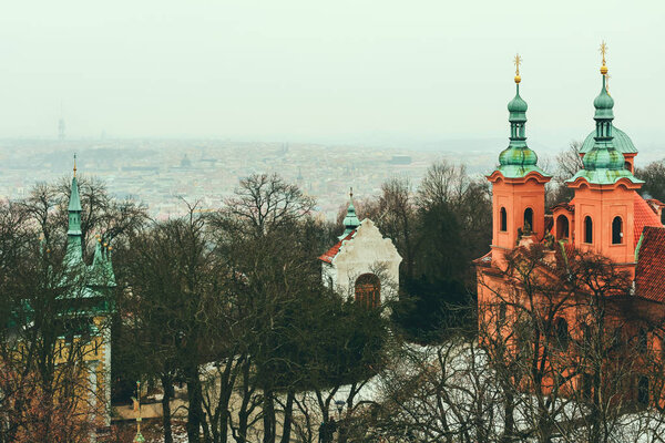 Aerial view of Prague skyline and St Lawrence Church from the viewing platform at the top of Petrin Observation Tower. Space for copy.