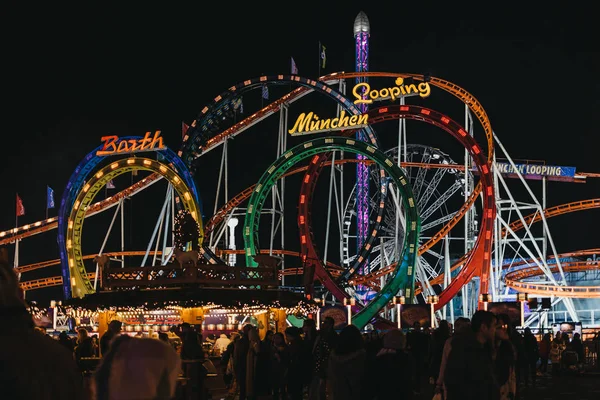 LONDON, UK - NOVEMBER 18, 2017: The Munich Looping Roller coaster ride at Winter Wonderland, annual Christmas Fair in London, UK. The Munich Looping is the worlds largest transportable roller coaster — Stock Image London November 2017 Munich Looping Roller Coaster Ride Winter Wonderland Stock Photo