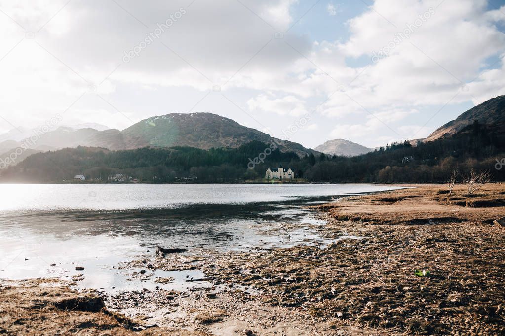 View of the Loch Shiel and Scottish landscape near Glenfinnan, Inverness-shire, Scotland, on a cold spring sunny day.