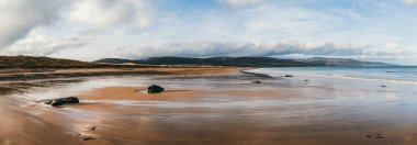 Panoramic view of award-winning mile long Brora beach, Scotland, UK. clipart