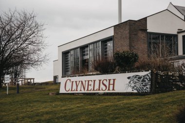BRORA, SCOTLAND - MARCH 22 2018:  View of new building of Clynelish Distillery, Brora, Scotland. The original Clynelish closed in the year 1967 as the new Clynelish distillery had been built.  clipart