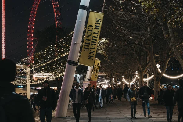 Signs outside Southbank Centre, London, UK, at night, people wal — Stock Photo, Image