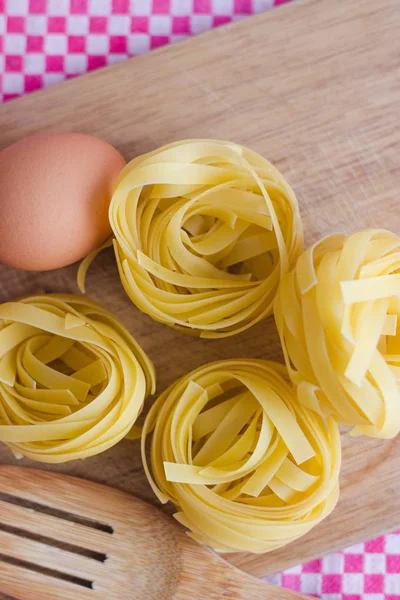 stock image top view homemade ingredients pasta, eggs in a cutboard table