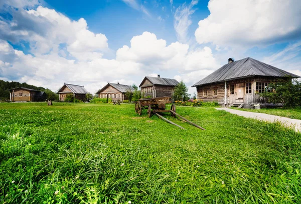 Rustic wooden house on a background of blue sky — Stock Photo, Image