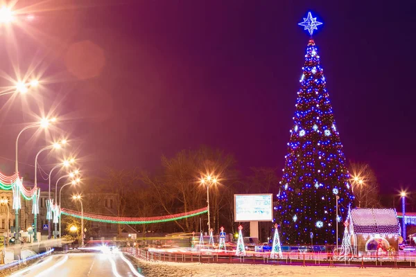 City Christmas tree on square at night