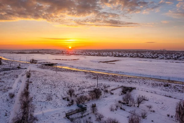 Dawn in winter over the field