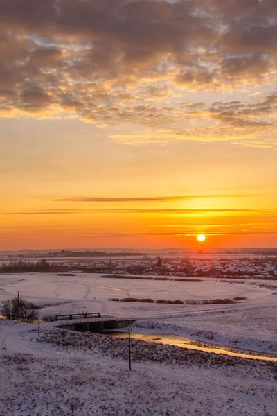 Winter morning with the sun on the horizon