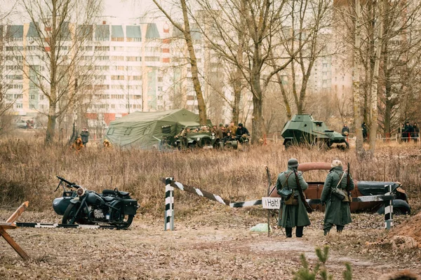 Two Wehrmacht soldiers are standing by the barrier. Reconstructi — Stock Photo, Image