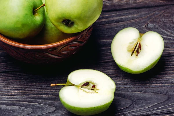 A bowl of apples and an apple in a section — Stock Photo, Image