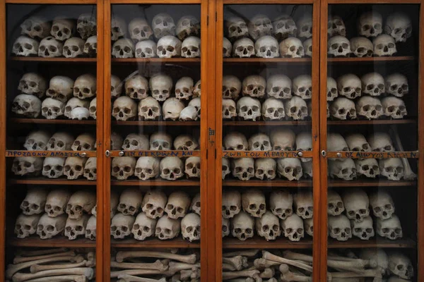 Skulls and bones together in a cabinet in Nea Moni, Chios, Greece.