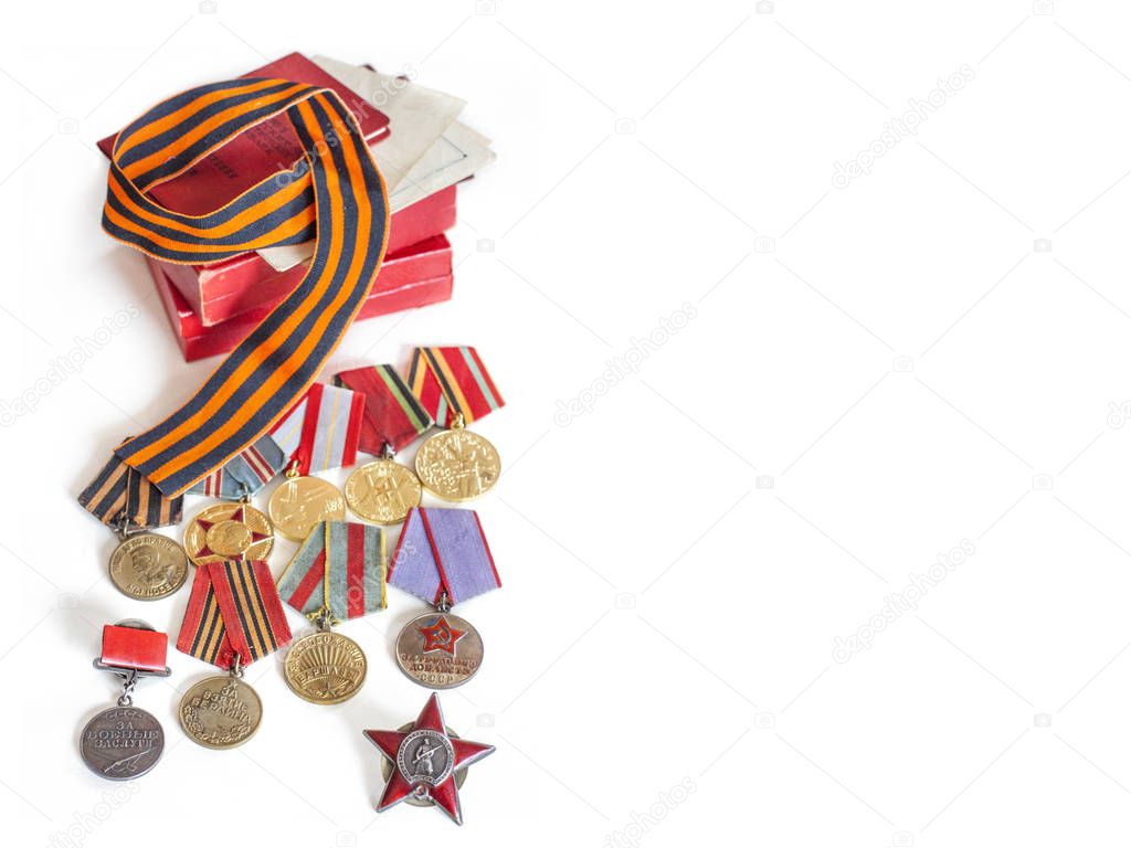 Concept May 9, victory USSR in the Second World War - Order of Red Star, medals for liberation of Berlin, Warsaw, for valor and merit and  St. George's ribbon, on white background, with place for text
