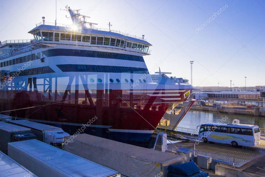 Passenger ferry in port on loading in clear sunny day in Helsinki, Scandinavia, Finland