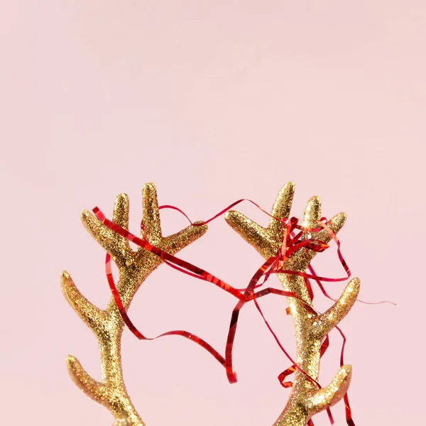 Golden Deer Horns Red Newfoot Tinsel Pink Background Xmas Composition — Stock Photo, Image