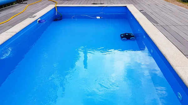 Swimming pool cleaner robot during vacuum service, maintenance.