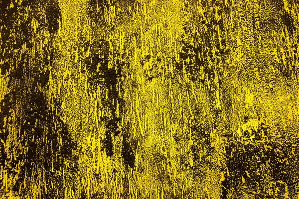 Black and yellow wall. Concrete wall painted into black and yellow. Black and yellow splashes on the wall.