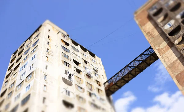 Post soviet architecture. blocks of flats connected with an iron bridge