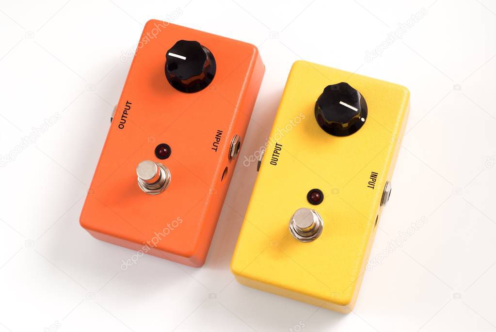 Yellow and orange guitar effect pedals 