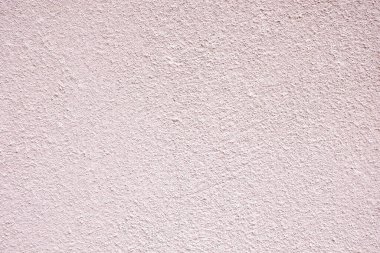 Pembeyle kaplı sert beton arka plan. Pembeye boyanmış duvar. Pembe duvar dokusu.