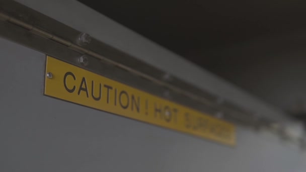 Special sign Caution. Hot surface. located on hot equipment. Safety precautions. Health hazard 4k Follow the focus. — Stock Video