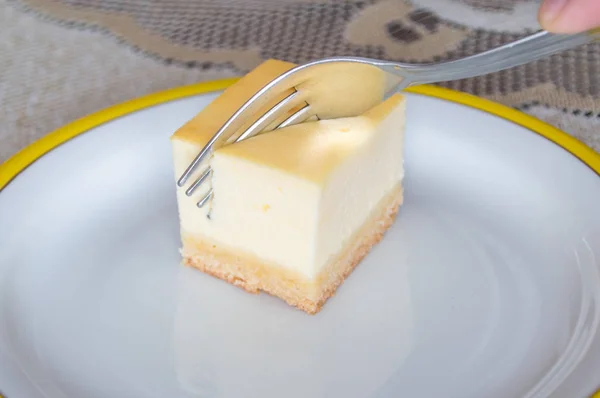 Cheesecake on white plate with fork. — Stock Photo, Image