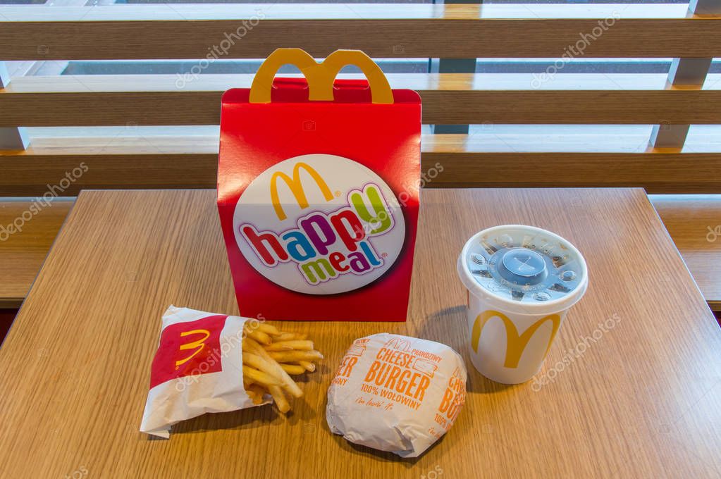 Gdansk, Poland - February 21, 2018: Mcdonalds happy meal box with Coca-Cola, french fries and cheeseburger.
