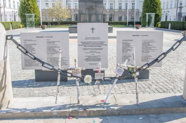 Warsaw, Poland - April 20, 2018: Wooden crosses commemorative Polish Air Force Tu-154 crash in 2010 at Smolensk. Crosses near Presidential Palace in Warsaw. clipart