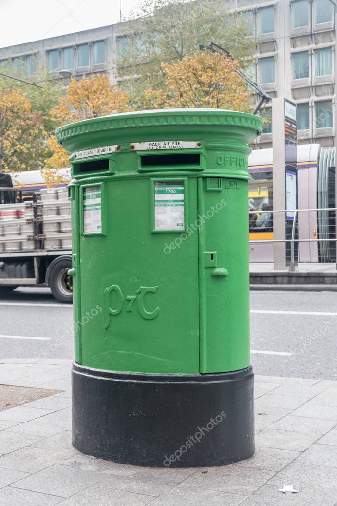 Dublin, Ireland - November 5, 2019: Green mail post box for Irish post service provider An Post.
