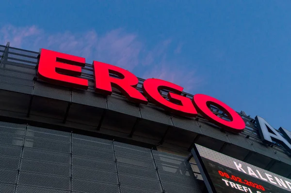 Red ERGO sign at ERGO ARENA sports and entertainment hall at sunset. — Stock Photo, Image