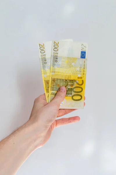 Billets de 200 euros en main . — Photo