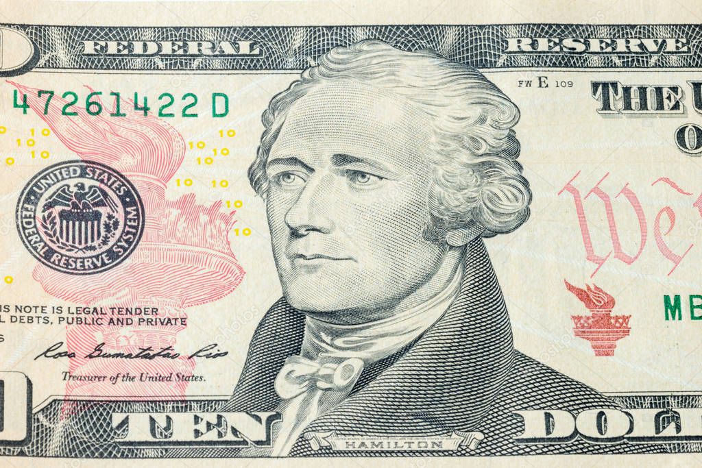 Portrait of U.S. president Alexander Hamilton on United States ten-dollar bill macro.