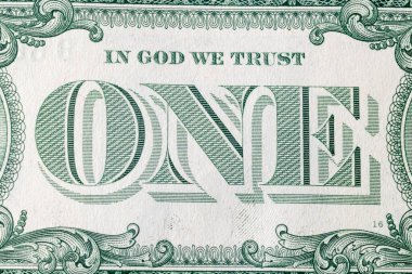 United States one-dollar bill, reverse side with In God We Trust motto.