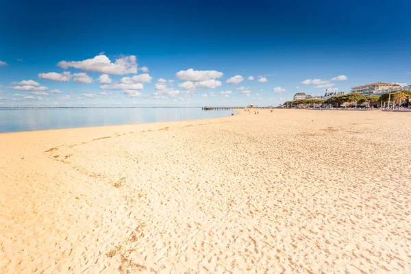 View of Arcachon beach on a sunny day. Arcachon is famous seaside town on the Atlantic ocean in Aquitaine, France.