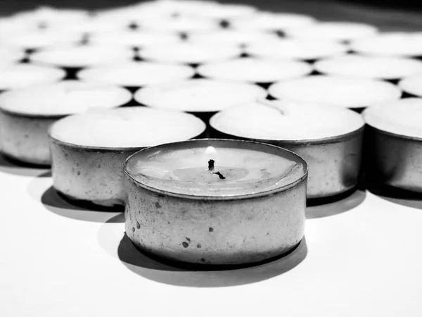 Closeup Black White Photograph Lots White Tea Candles Metal Enclosure — Stock Photo, Image