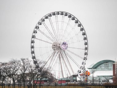 Chicago, IL - February 28th, 2018: The centennial wheel ferris wheel on Navy Pier reaches a height of 198 feet which is 48 feet taller than its predecessor. clipart
