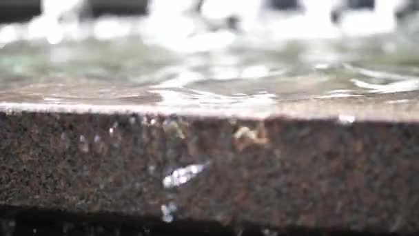 Closeup Slow Motion Clip Water Cascading Edge Brown Granite Reflecting — Stock Video
