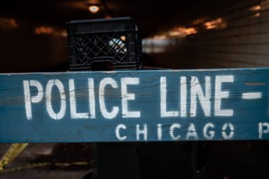 Close up of a blue Chicago police barricade blocking an underpass leading the lakefront parks due to the COVID-19 coronavirus pandemic. clipart