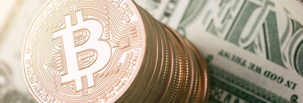 Bitcoin (BTC) cryptocurrency on dollar notes, digital money — Stock Photo, Image