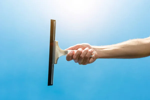 Man cleaning window with squeegee — Stock Photo, Image