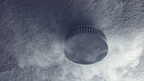 Smoke detector with smoke closeup — Stock Photo, Image