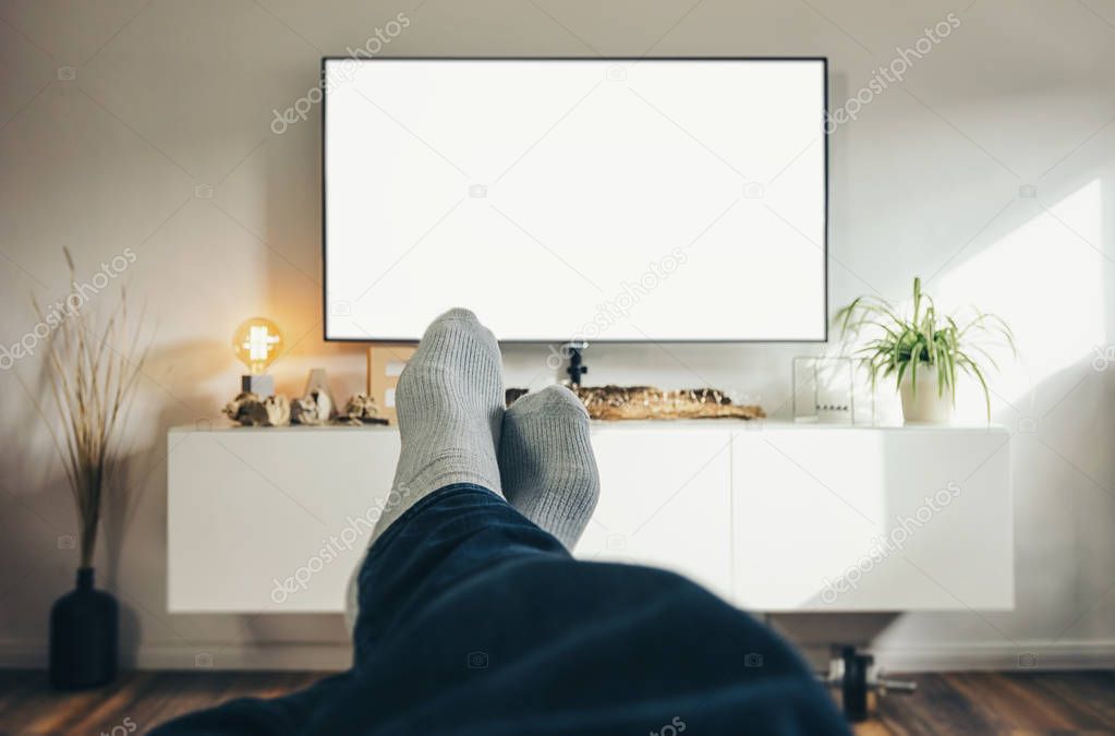 Man Watching TV in his living room, point of view perspective.