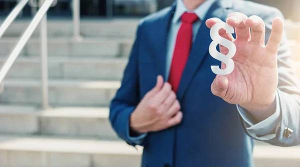 Lawyer holding paragraph sign — Stock Photo, Image