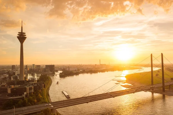 Aerial view of dusseldorf at sunset with the Rheinknie Bridge — Stock Photo, Image