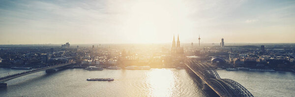 View of the Cologne skyline with Cathedral and hohenzollern bridge at sunset, banner size. ideal for websites and magazines layouts