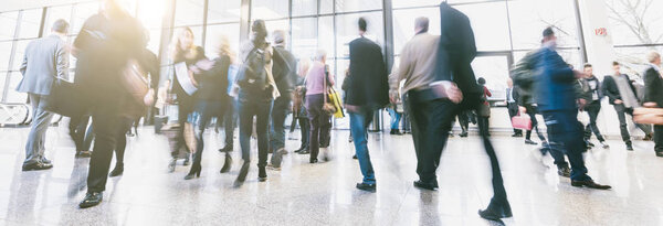 Anonymous crowd of business people walking