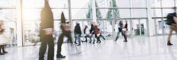 Anonymous Crowd of business people at a corridor