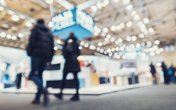 Abstract people in a trade fair hall event background usage