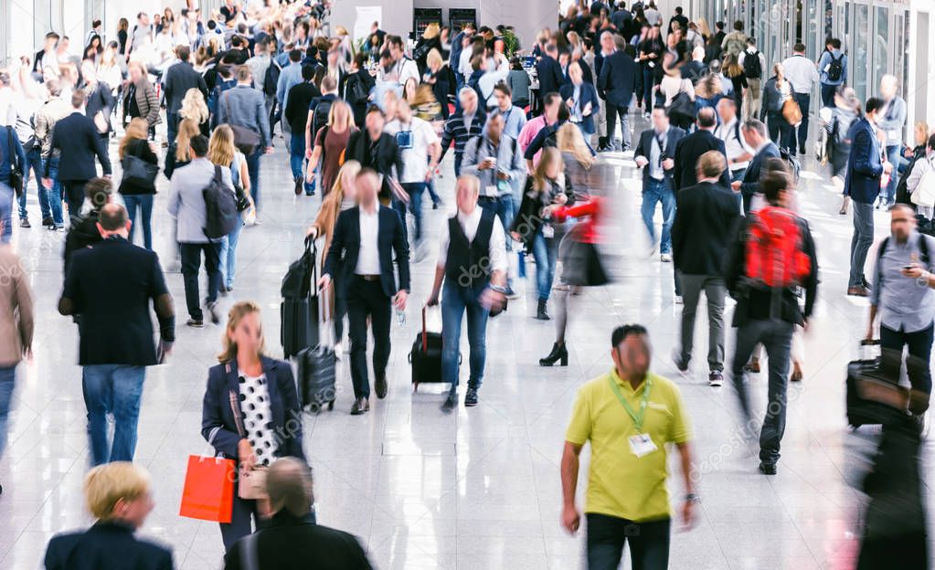 Large crowd of business people walking